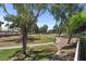Lush community park with mature trees, walking paths, and green spaces provides a scenic and recreational area at 1761 E Countrywalk Ln, Chandler, AZ 85225