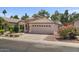 Attractive home with desert landscaping, a two-car garage, and a well-manicured front yard at 1761 E Countrywalk Ln, Chandler, AZ 85225