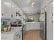 Modern kitchen featuring white cabinets, stainless steel appliances, and stylish countertops at 1761 E Countrywalk Ln, Chandler, AZ 85225