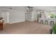 Spacious living room with high ceilings, modern floors, and ample natural light at 1761 E Countrywalk Ln, Chandler, AZ 85225