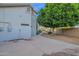 Gravel backyard featuring an established shade tree and desert plantings at 18161 N 63Rd Ln, Glendale, AZ 85308