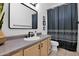 Stylish bathroom with modern fixtures, ample countertop space, and a decorative mirror, creating a functional space at 18161 N 63Rd Ln, Glendale, AZ 85308