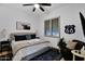 Comfortable bedroom featuring stylish decor, a cozy armchair, and plenty of natural light, creating a relaxing atmosphere at 18161 N 63Rd Ln, Glendale, AZ 85308