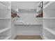 Organized walk-in closet with ample shelving and hanging space, providing efficient storage solutions at 18161 N 63Rd Ln, Glendale, AZ 85308