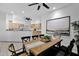 The dining room has a large picture window and views into the kitchen at 18161 N 63Rd Ln, Glendale, AZ 85308