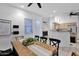 Open concept, dining room with view of the kitchen, and modern fixtures at 18161 N 63Rd Ln, Glendale, AZ 85308
