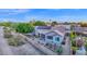 Aerial shot of the back of the house showing a fenced yard, patio, and solar panels at 18161 N 63Rd Ln, Glendale, AZ 85308