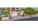 Charming single-story home featuring a well-manicured lawn, solar panels, and a two-car garage at 18161 N 63Rd Ln, Glendale, AZ 85308