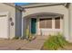 Close up of a welcoming front porch with a decorative door and desert-friendly landscaping at 18161 N 63Rd Ln, Glendale, AZ 85308