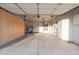 Spacious garage featuring a large storage cabinet along one side at 18161 N 63Rd Ln, Glendale, AZ 85308