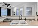 A large kitchen sink with updated fixtures and natural light from a window at 18161 N 63Rd Ln, Glendale, AZ 85308