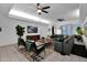Bright living room features stylish furnishings, a modern ceiling fan, and lots of natural light at 18161 N 63Rd Ln, Glendale, AZ 85308