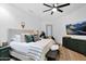 This main bedroom is bright with neutral decor, a ceiling fan, and updated fixtures at 18161 N 63Rd Ln, Glendale, AZ 85308