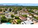 This aerial shows the community surrounding lush greenery, mountain views and swimming pools at 1820 W Seldon Way, Phoenix, AZ 85021