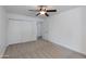 Bedroom with carpet flooring, ceiling fan and a doorway to another room at 1820 W Seldon Way, Phoenix, AZ 85021