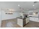 Modern kitchen with white cabinetry, stainless steel appliances, and a large island with seating at 1820 W Seldon Way, Phoenix, AZ 85021
