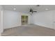Carpeted living room with access to the backyard via sliding glass doors at 1820 W Seldon Way, Phoenix, AZ 85021