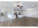 Open-concept living space showcasing access to backyard and renovated kitchen with modern design elements at 1820 W Seldon Way, Phoenix, AZ 85021