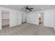 Spacious main bedroom featuring a ceiling fan, carpet, and access to a closet and bathroom at 1820 W Seldon Way, Phoenix, AZ 85021