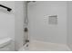 Shower featuring white subway tile, mosaic accents, shower head, and built-in niche at 1820 W Seldon Way, Phoenix, AZ 85021