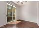 Balcony access from open room with hardwood floors and natural light at 18250 N Cave Creek Rd # 139, Phoenix, AZ 85032