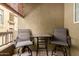 Balcony featuring an outdoor table and two chairs, offering a cozy space for relaxation and outdoor enjoyment at 18250 N Cave Creek Rd # 139, Phoenix, AZ 85032