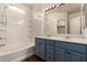 Bright bathroom featuring a double vanity, tub, and shower with tile surround at 18250 N Cave Creek Rd # 139, Phoenix, AZ 85032