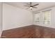 Spacious bedroom with hardwood floors, natural light, and a ceiling fan at 18250 N Cave Creek Rd # 139, Phoenix, AZ 85032