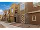 Charming townhome community with colorful exteriors and landscaped walkways at 18250 N Cave Creek Rd # 139, Phoenix, AZ 85032