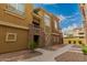 Inviting townhome exterior with brick accents and low-maintenance desert landscaping at 18250 N Cave Creek Rd # 139, Phoenix, AZ 85032