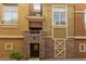 Charming townhome with a brick entryway, covered balcony, and desert landscaping at 18250 N Cave Creek Rd # 139, Phoenix, AZ 85032