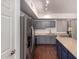Modern kitchen with stainless steel appliances, gray cabinets, and an island at 18250 N Cave Creek Rd # 139, Phoenix, AZ 85032