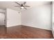 Bright, open living room featuring hardwood floors, ceiling fan, and ample natural light at 18250 N Cave Creek Rd # 139, Phoenix, AZ 85032