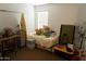 Bedroom space with a bed, desk, and natural light from the window at 1927 E Hampton Ave # 208, Mesa, AZ 85204