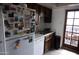 Bright kitchen with white refrigerator and view to back patio at 1927 E Hampton Ave # 208, Mesa, AZ 85204