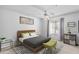 Bright bedroom featuring a cozy bed, ceiling fan, window with natural light, and stylish decor at 2201 N Comanche Dr # 1094, Chandler, AZ 85224