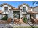 Inviting home exterior showcases a well-manicured lawn, brick accents, and gated entrance at 2201 N Comanche Dr # 1094, Chandler, AZ 85224