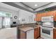 Bright, open kitchen featuring stainless appliances and a convenient breakfast bar area at 2201 N Comanche Dr # 1094, Chandler, AZ 85224