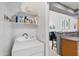 Efficient laundry room with washer/dryer and shelving for organized storage solutions at 2201 N Comanche Dr # 1094, Chandler, AZ 85224