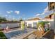 Backyard featuring a playhouse, a play kitchen, and a gravel area at 22858 E Silver Creek Ln, Queen Creek, AZ 85142