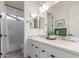 Bright bathroom features a double vanity with modern fixtures and a separate shower/tub area at 22858 E Silver Creek Ln, Queen Creek, AZ 85142