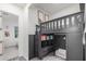 A modern bedroom features a playful lofted bed with storage underneath and gray decor at 22858 E Silver Creek Ln, Queen Creek, AZ 85142