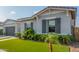 Inviting single-story home featuring lush lawn, landscaping, and an attached two-car garage at 22858 E Silver Creek Ln, Queen Creek, AZ 85142