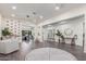 Bright and spacious living room with contemporary decor, stylish furnishings, and ample natural light at 22858 E Silver Creek Ln, Queen Creek, AZ 85142