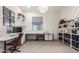 Bright home office with ample workspace, open shelving, and neutral decor for a productive atmosphere at 22858 E Silver Creek Ln, Queen Creek, AZ 85142