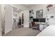 Spacious home office featuring dual monitors, built-in shelving, and abundant natural light at 22858 E Silver Creek Ln, Queen Creek, AZ 85142