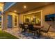 Inviting outdoor patio with a dining table and chairs, perfect for entertaining at 22858 E Silver Creek Ln, Queen Creek, AZ 85142