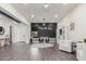 Spacious playroom with modern lighting, a chalkboard wall, built-in storage, and comfortable seating at 22858 E Silver Creek Ln, Queen Creek, AZ 85142