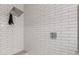 Modern shower features white subway tile with a rainfall shower head at 22858 E Silver Creek Ln, Queen Creek, AZ 85142