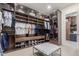 Custom walk-in closet with ample storage and designer shelving at 22858 E Silver Creek Ln, Queen Creek, AZ 85142